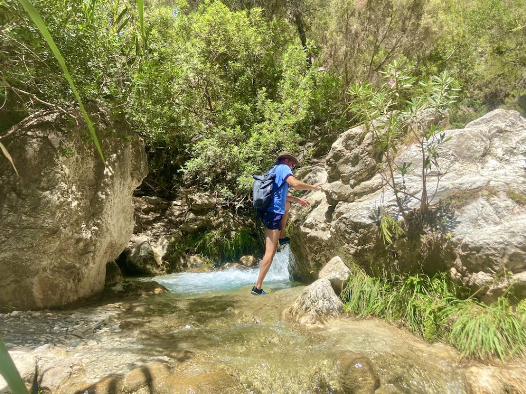 hiking through a river in Andalusia